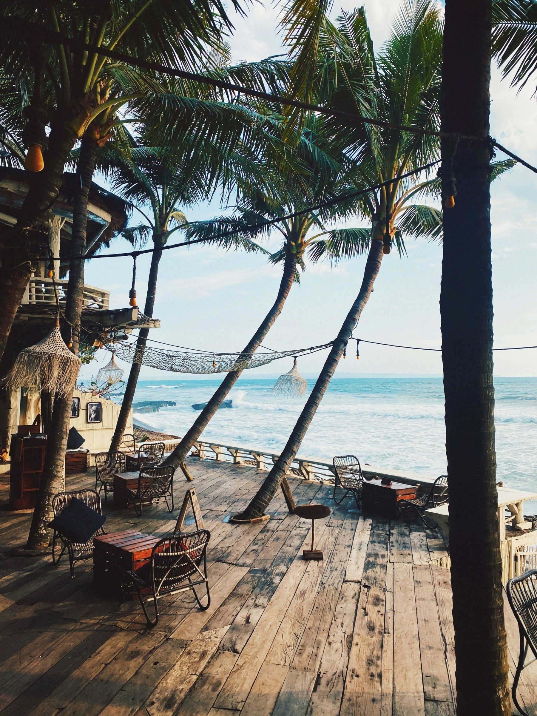 A beachfront deck beneath the palms, Canggu, Bali