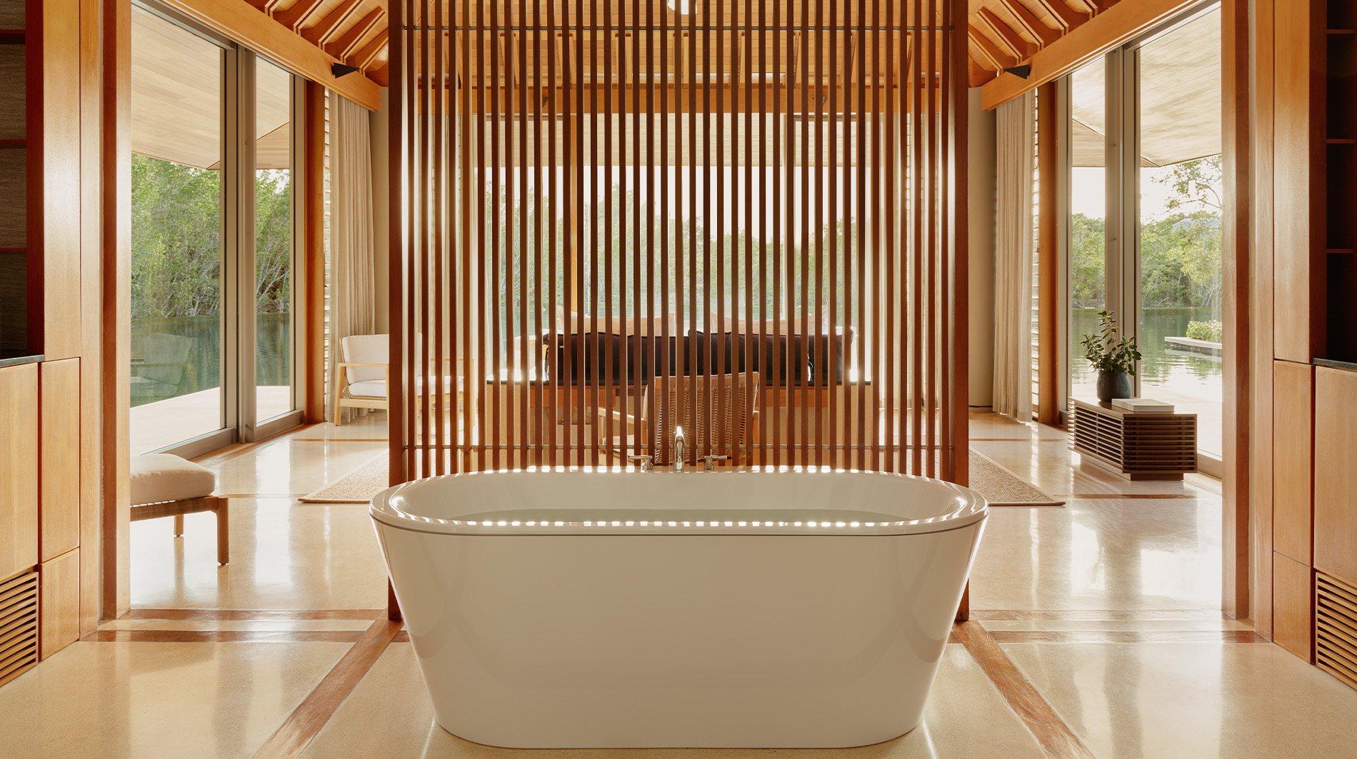 Ocean-view pavilion interior at Amanyara with timber, linen and clean lines