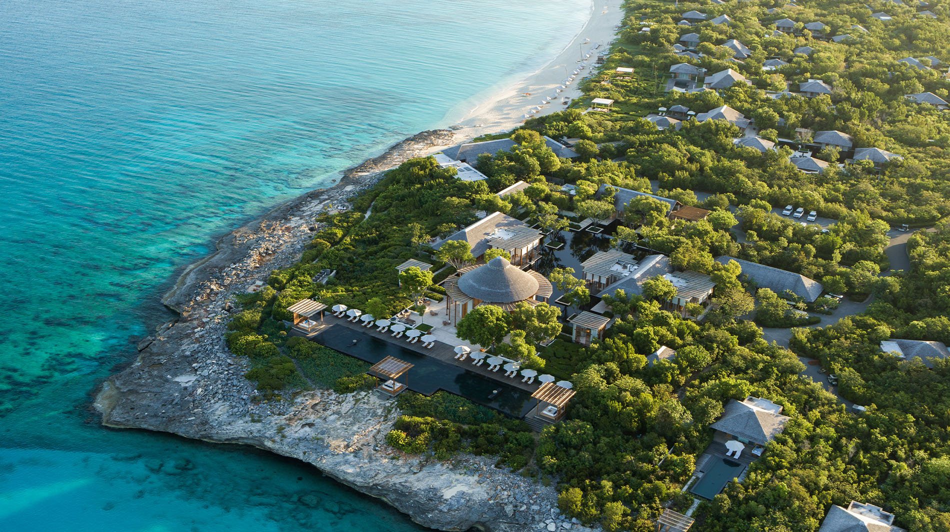 Dining at Amanyara, an open pavilion looking over the water at dusk