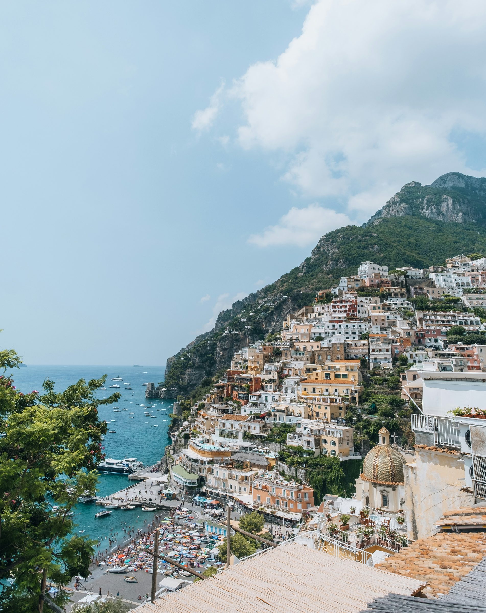 A quiet cove and clear turquoise sea below the cliffs of the Amalfi Coast