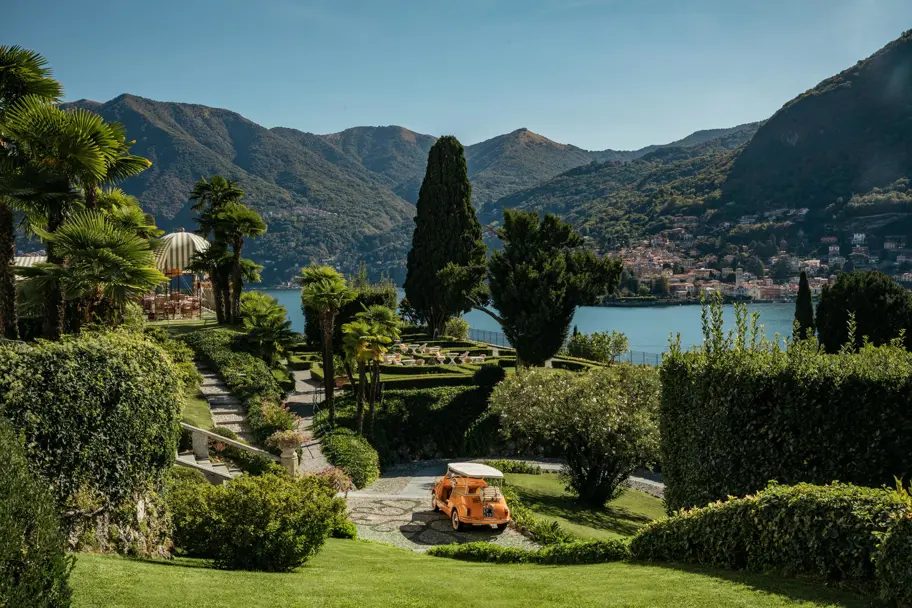 Lakeside gardens and a vintage car above Lake Como