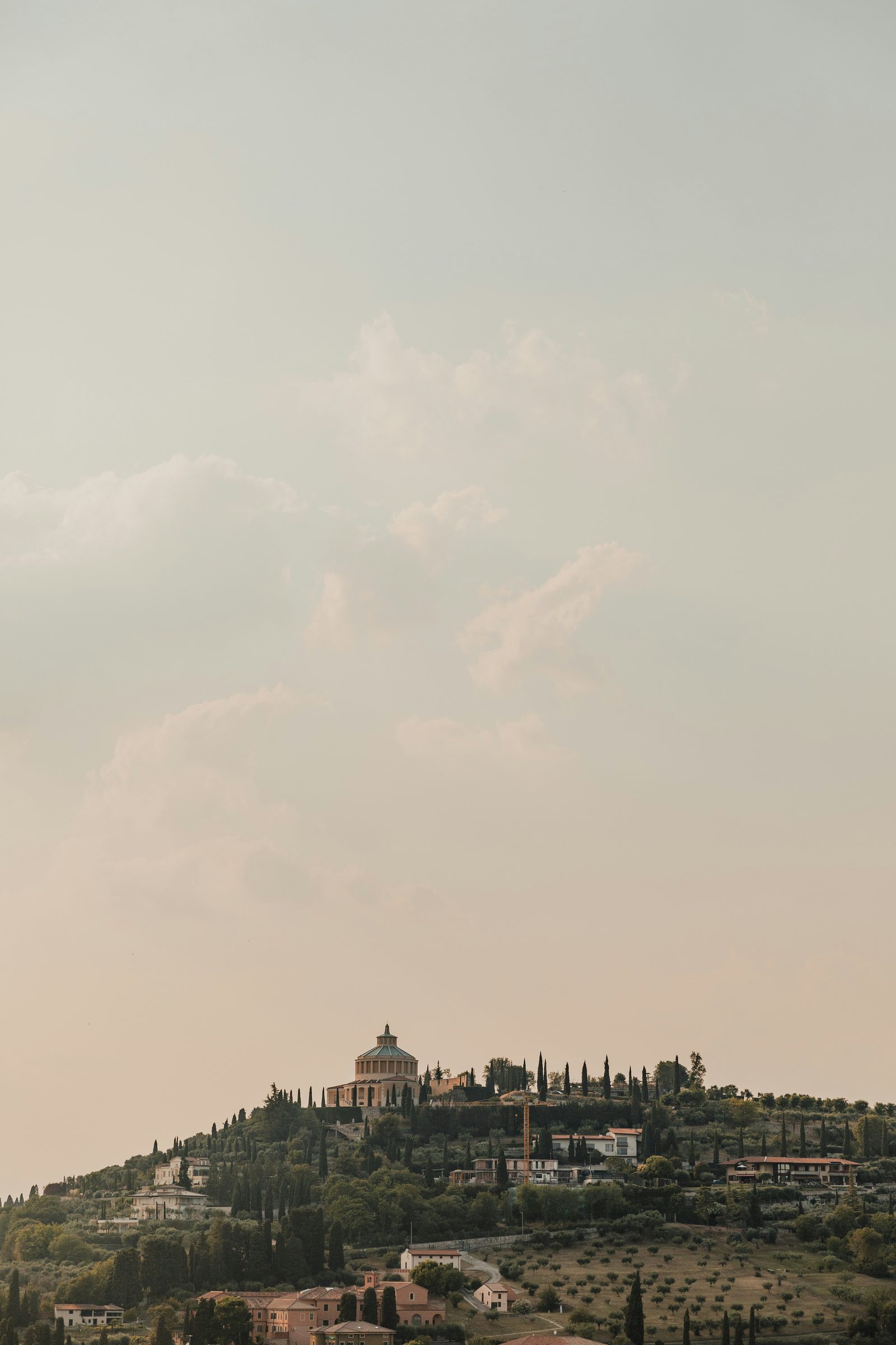 A misty Tuscan farmhouse at dawn, the Val d'Orcia, Italy
