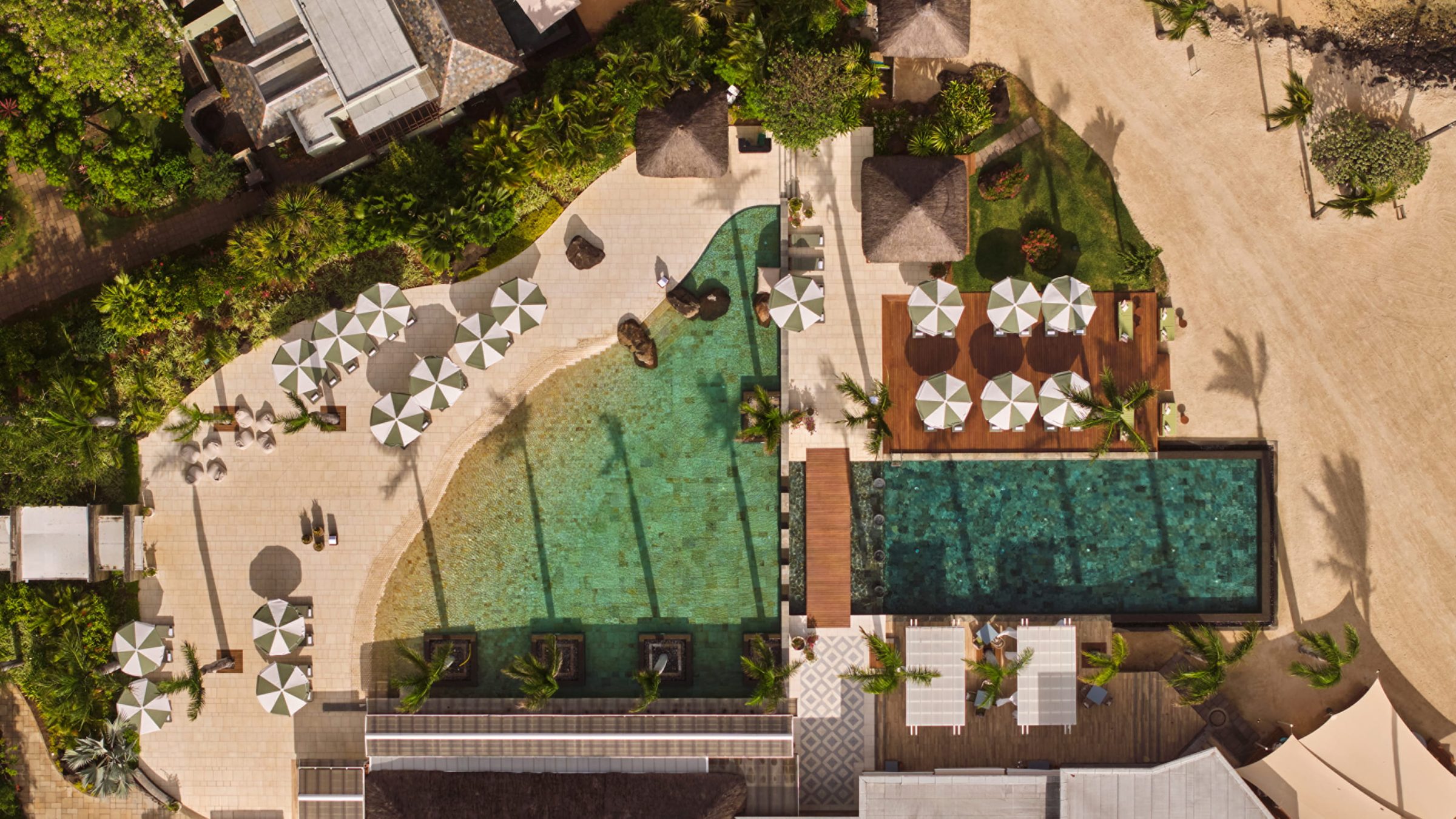 Aerial of the resort pool among gardens, Four Seasons Resort Mauritius at Anahita