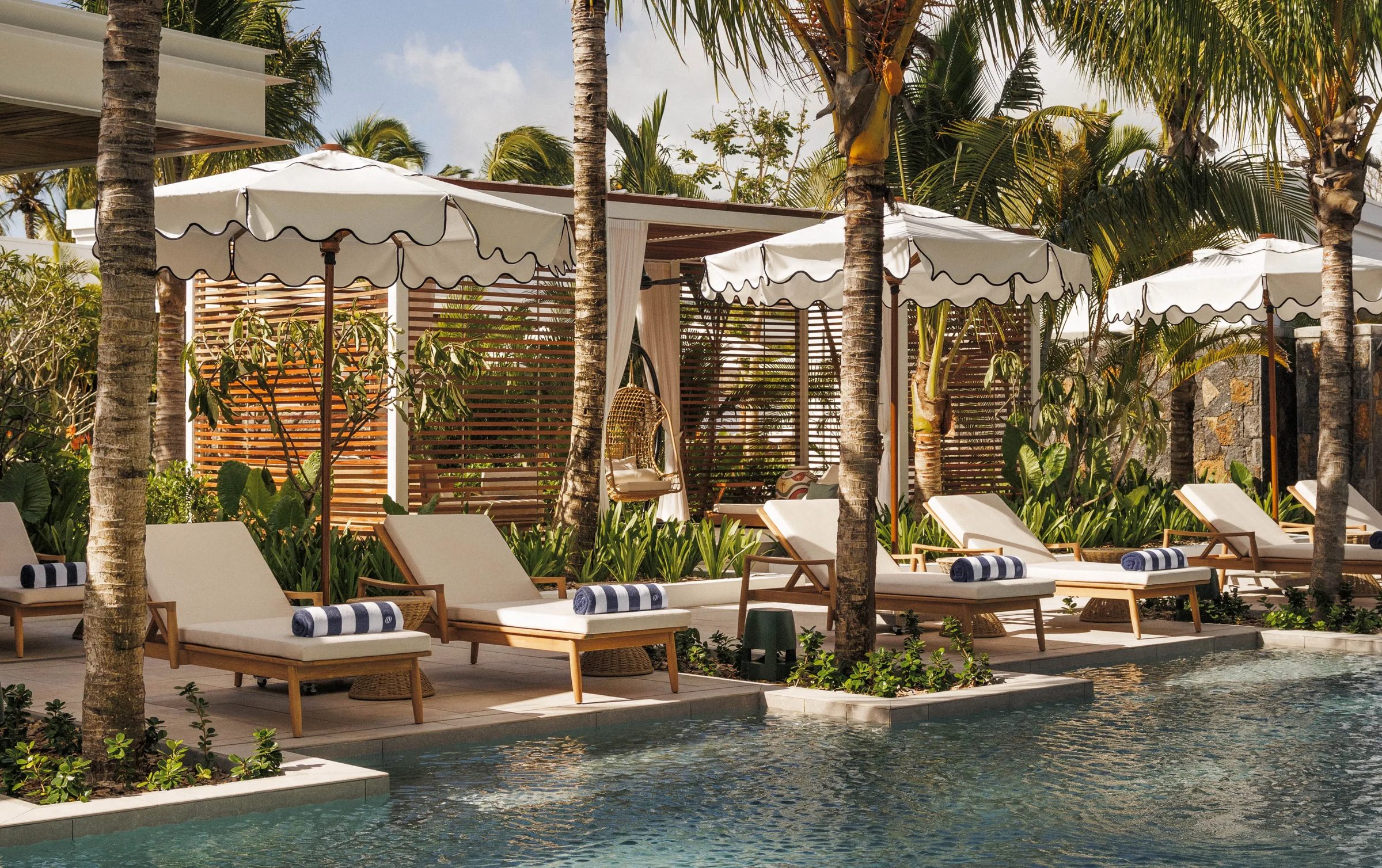Cabanas and loungers beside the pool at One&Only Le Saint Geran, Mauritius