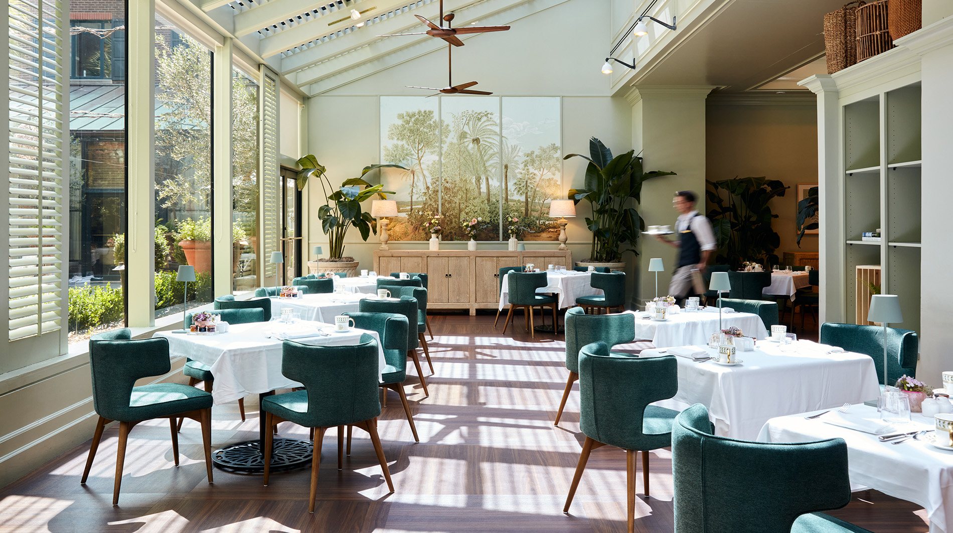 The glass-roofed rooftop pool and terrace at The Charleston Place
